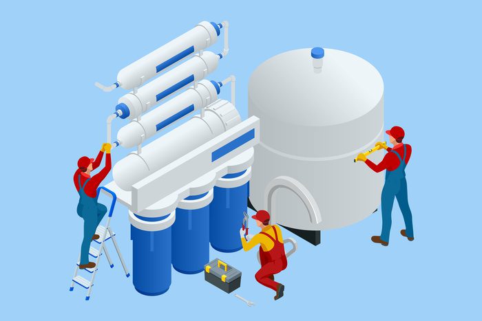 experts installing or repairing system of water treatment system.