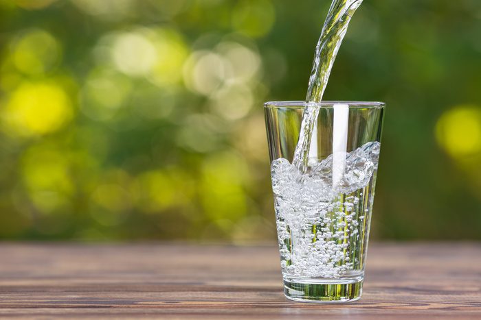 purified water pouring into glass